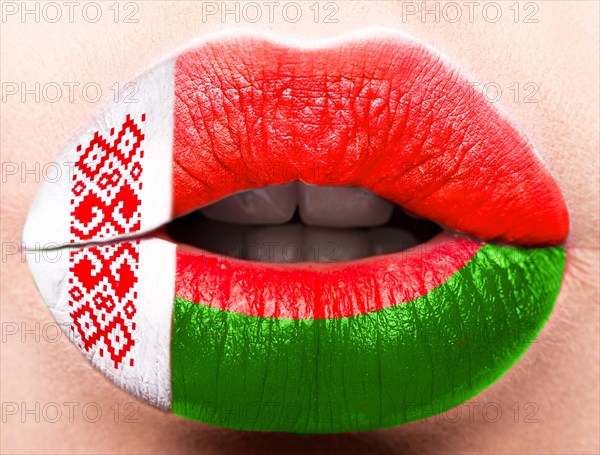 Female lips close up with a picture of the flag of Belarus. red