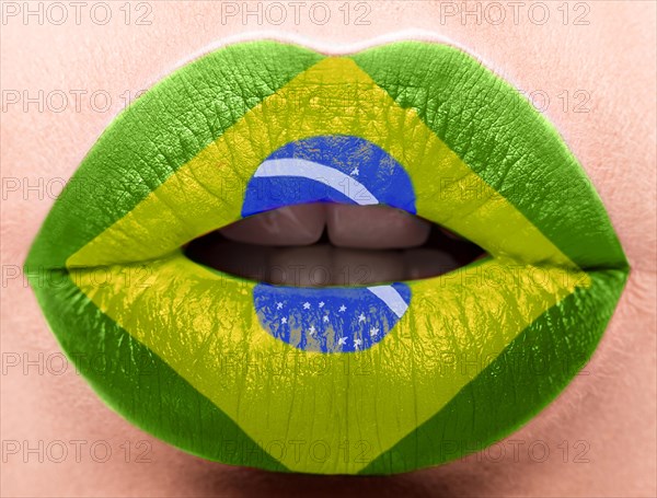 Female lips close up with a picture of the flag of Brazil. green