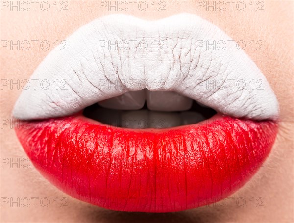 Female lips close up with a picture of the flag of Poland. white