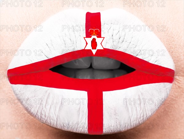Female lips close up with a picture of the flag of Northern Ireland. white