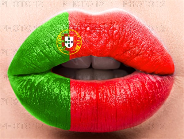 Female lips close up with a picture of the flag of Portugal. red