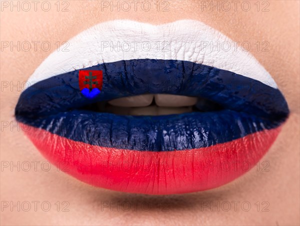 Female lips close up with a picture of the flag of Slovakia. Blue