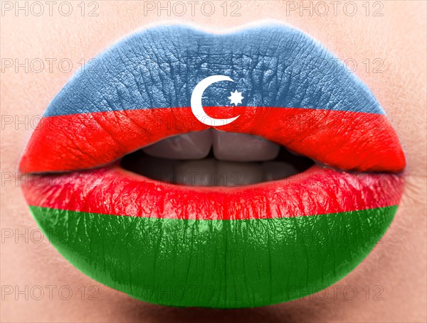 Female lips close up with a picture of the flag of Azerbaijan. Blue