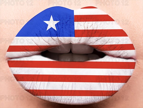 Female lips close up with a picture of the flag of Liberia. white