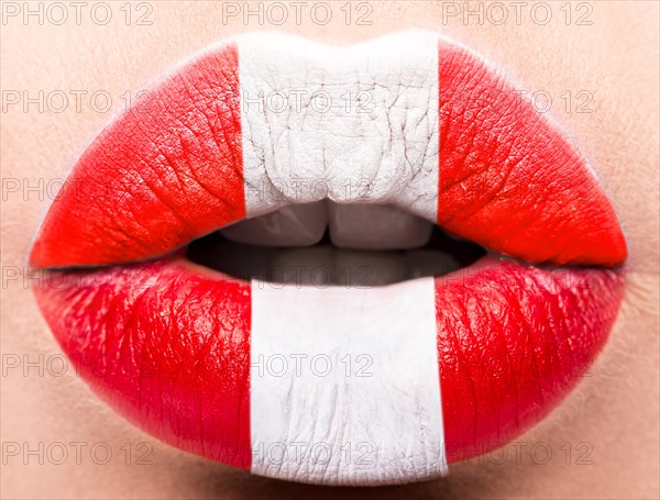 Female lips close up with a picture of the flag of Peru. white
