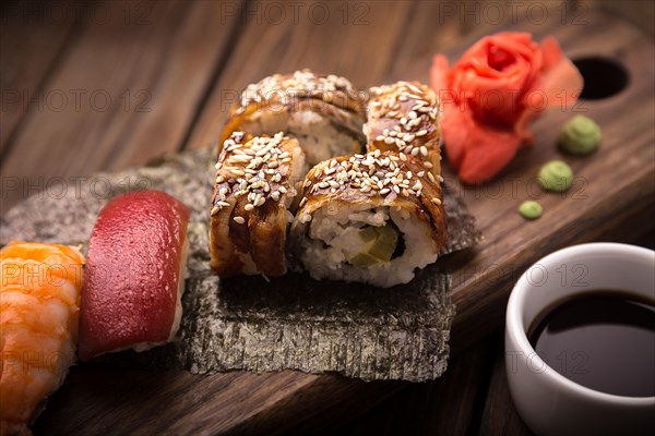 Sushi set on a wooden tray. Photo shot in studio