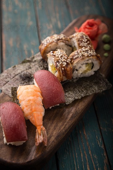 Sushi set on a wooden tray. Photo shot in studio