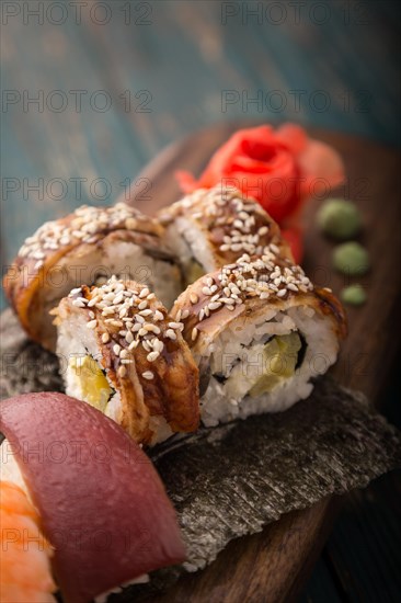 Sushi set on a wooden tray. Photo shot in studio