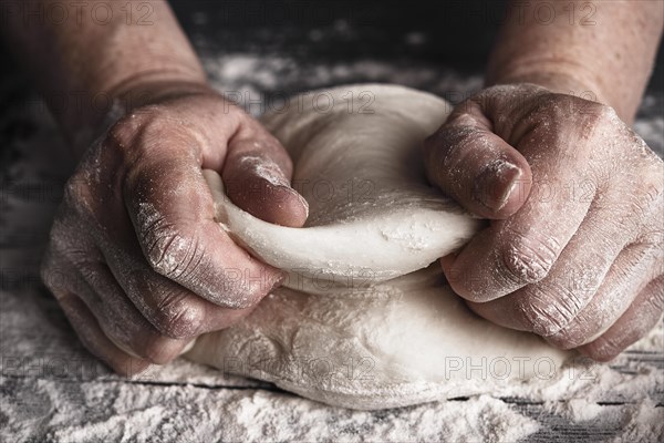 Cooking dough by elderly woman cook hands for homemade pastry bread