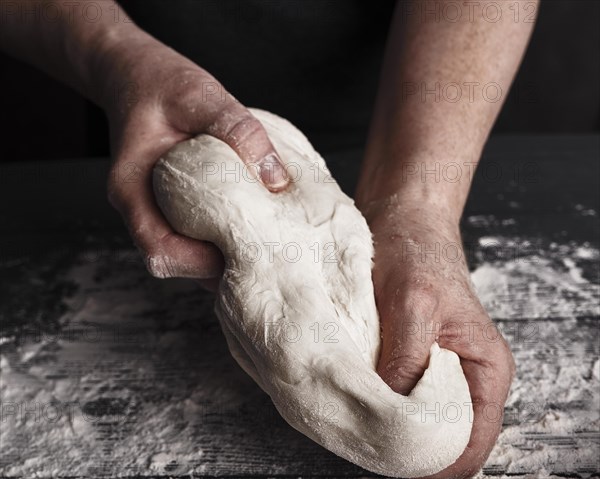 Cooking dough by elderly woman cook hands for homemade pastry bread