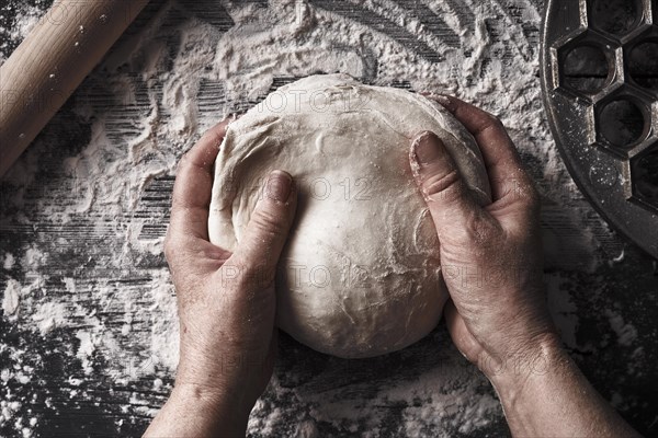 Cooking dough by elderly woman cook hands for homemade pastry bread