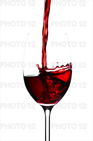 Red wine in a glass isolated on white background