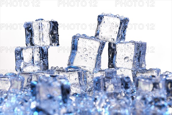 Transparent cold ice cubes on a white background