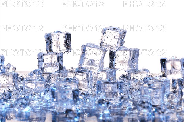 Transparent cold ice cubes on a white background