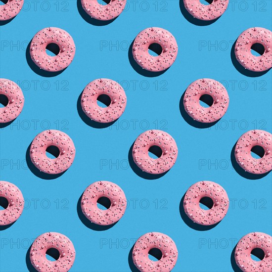 Sweet donuts pattern on a blue background