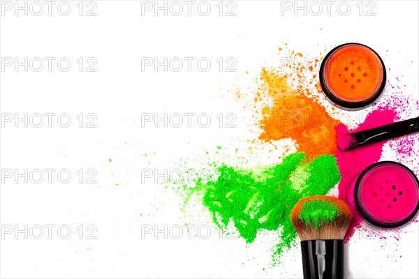 Cheek brush with neon cosmetic powder colorful pile and isolated on white background