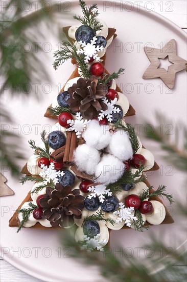 Pastry cake cookies in the form of a Christmas tree with cones