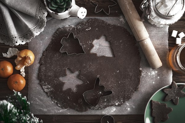 Preparing Christmas cookies. Dough on the table with baking dishes