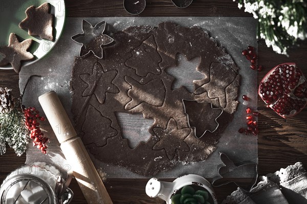 Preparing Christmas cookies. Dough on the table with baking dishes