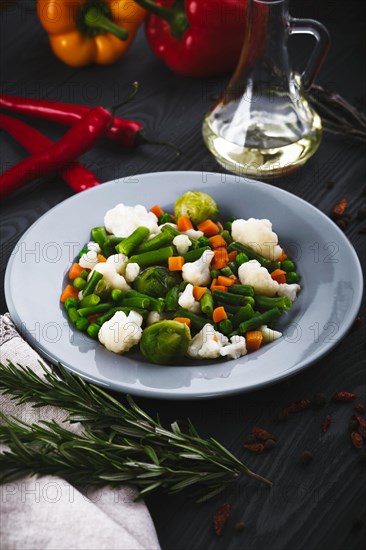 Delicious mix of vegetables on the plate. View from above