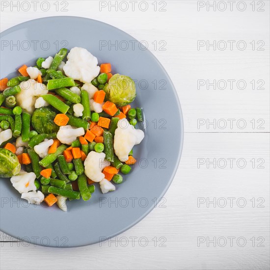 Delicious mix of vegetables on the plate. View from above