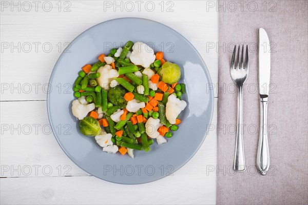 Delicious mix of vegetables on the plate. View from above