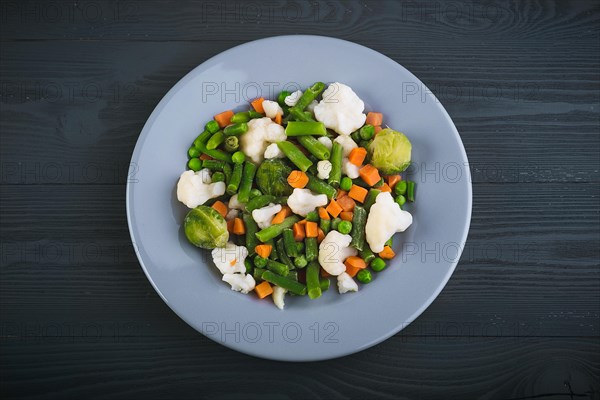 Delicious mix of vegetables on the plate. View from above