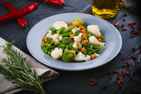 Delicious mix of vegetables on the plate. View from above