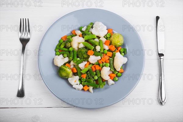 Delicious mix of vegetables on the plate. View from above