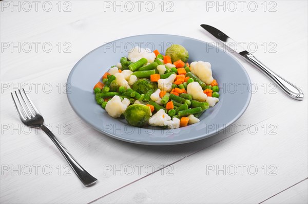 Delicious mix of vegetables on the plate. View from above