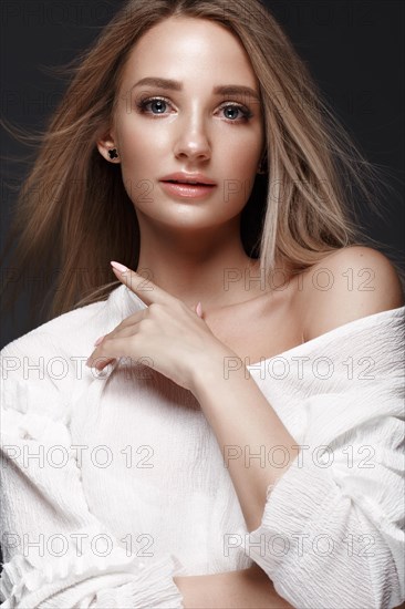 Beautiful woman with evening make-up and long straight hair