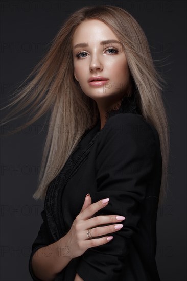 Beautiful woman with evening make-up and long straight hair