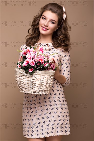 Fresh young girl in a light silk dress