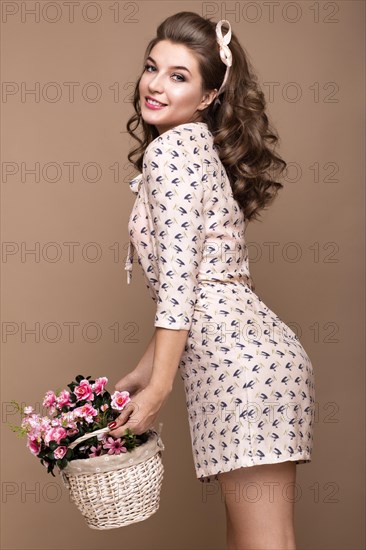 Fresh young girl in a light silk dress