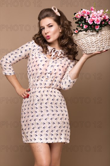 Fresh young girl in a light silk dress