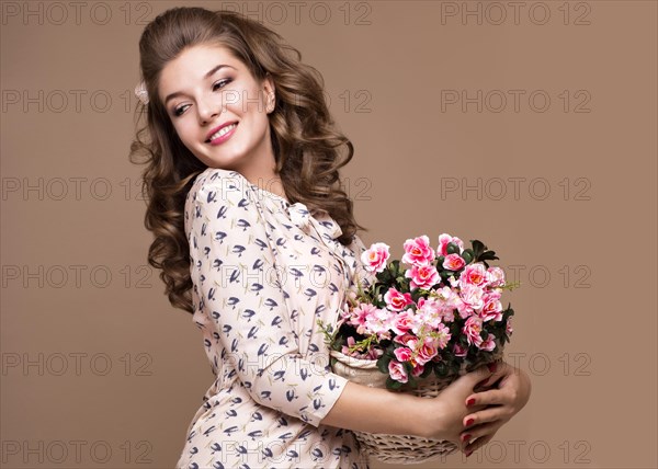 Fresh young girl in a light silk dress