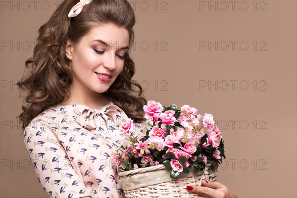 Fresh young girl in a light silk dress