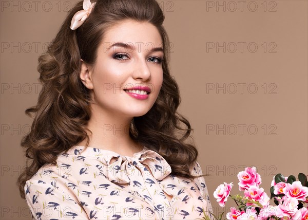 Fresh young girl in a light silk dress