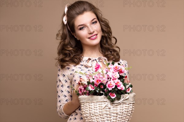 Fresh young girl in a light silk dress