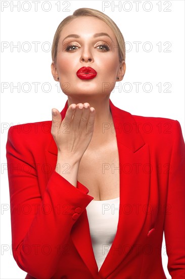 Showy sexy blond woman in red clothes
