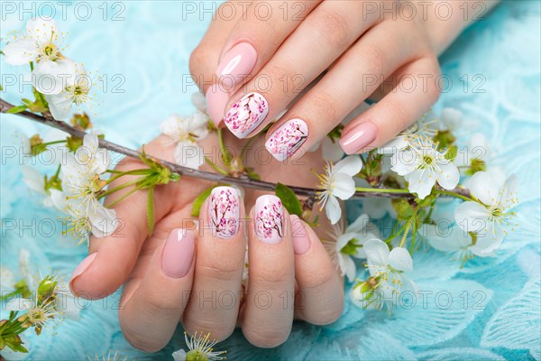 Spring manicure for the bride in gentle tones with flowers. Nail Design