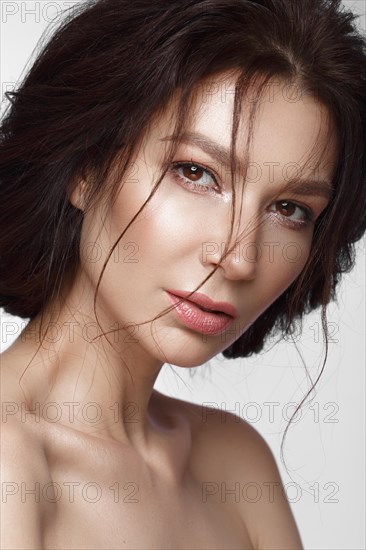 Beautiful woman with a light natural make-up and perfect skin