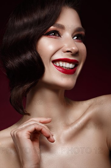 Beautiful girl in Hollywood image with wave hair and classic makeup. Beauty face. Photo taken in the studio