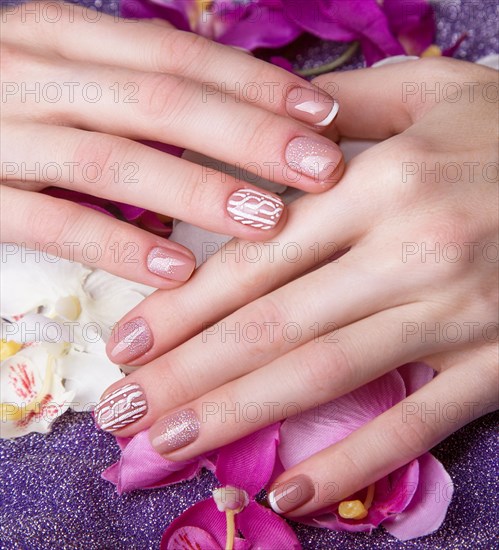 Snow White manicure on female hands. Winter nail design. Picture taken in the studio