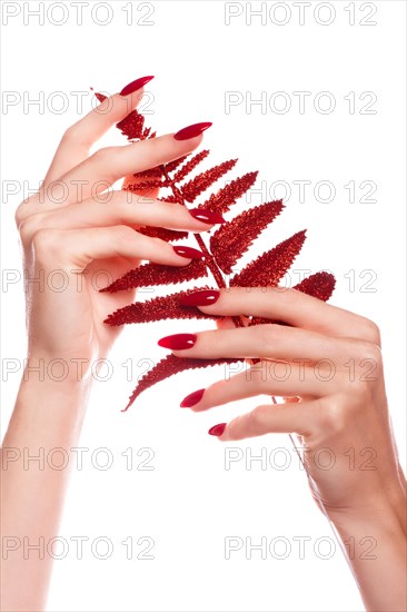 Bright festive red manicure on female hands. Nails design