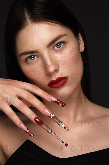 Portrait of a beautiful woman with classic make up in glamorous style