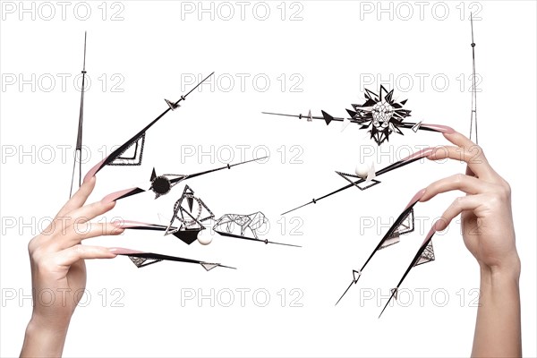 Creative design of nails on female hands. Art manicure. Photo taken in studio