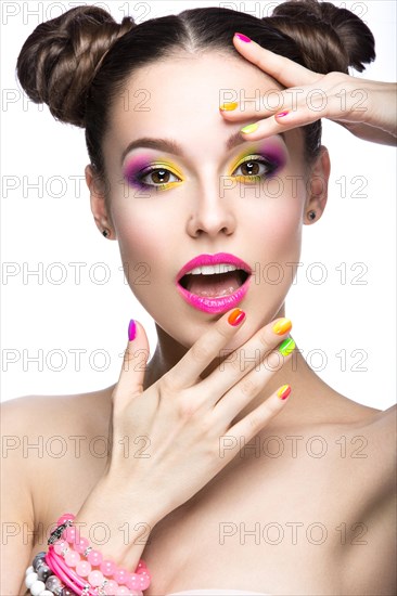 Beautiful girl in pink sunglasses with bright makeup and colorful nails. Beauty face. Picture taken in the studio on a white background