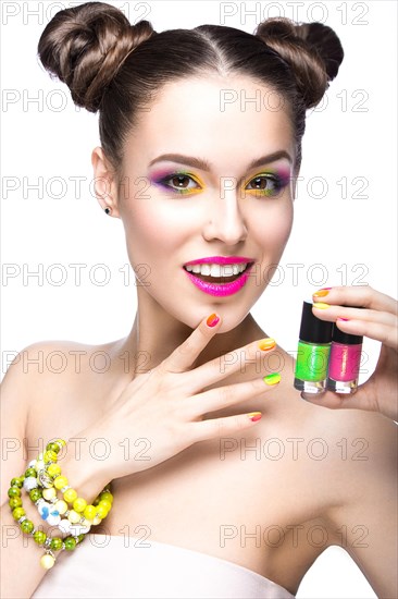 Beautiful girl in pink sunglasses with bright makeup and colorful nails. Beauty face. Picture taken in the studio on a white background
