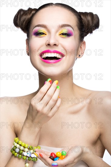 Beautiful girl in pink sunglasses with bright makeup and colorful nails. Beauty face. Picture taken in the studio on a white background